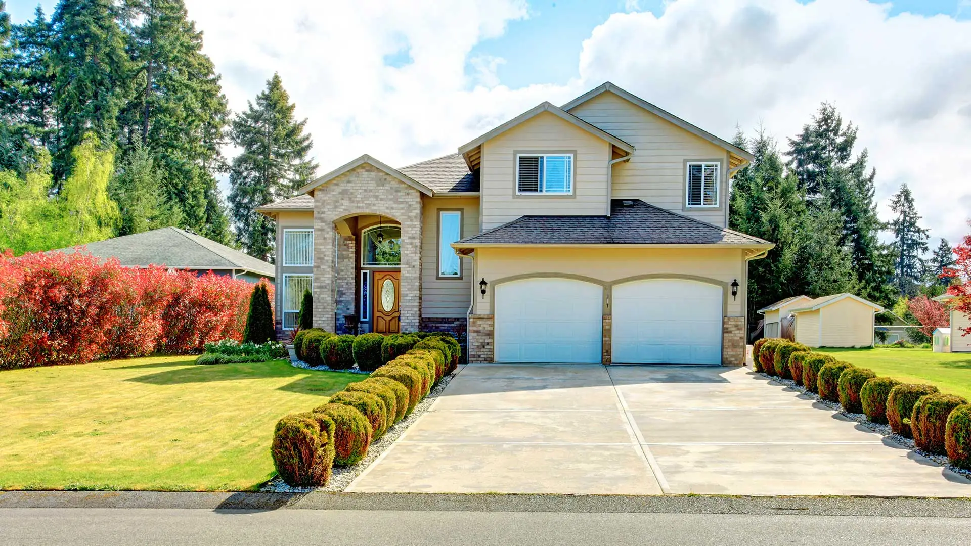 A home with maintained lawn and landscaping in Buda, TX.