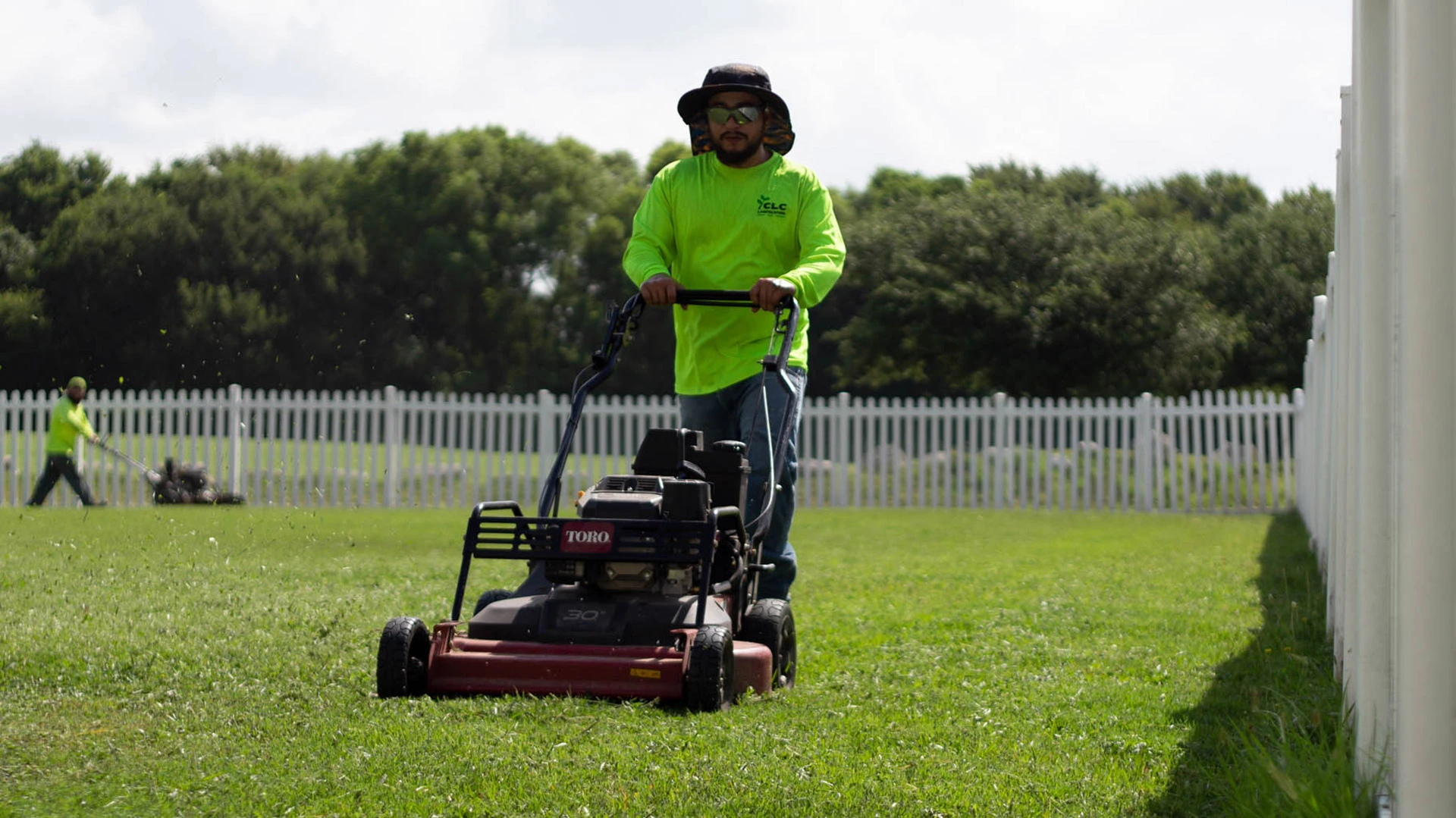 CLC professional mowing a customer's lawn in San Marcos, TX.
