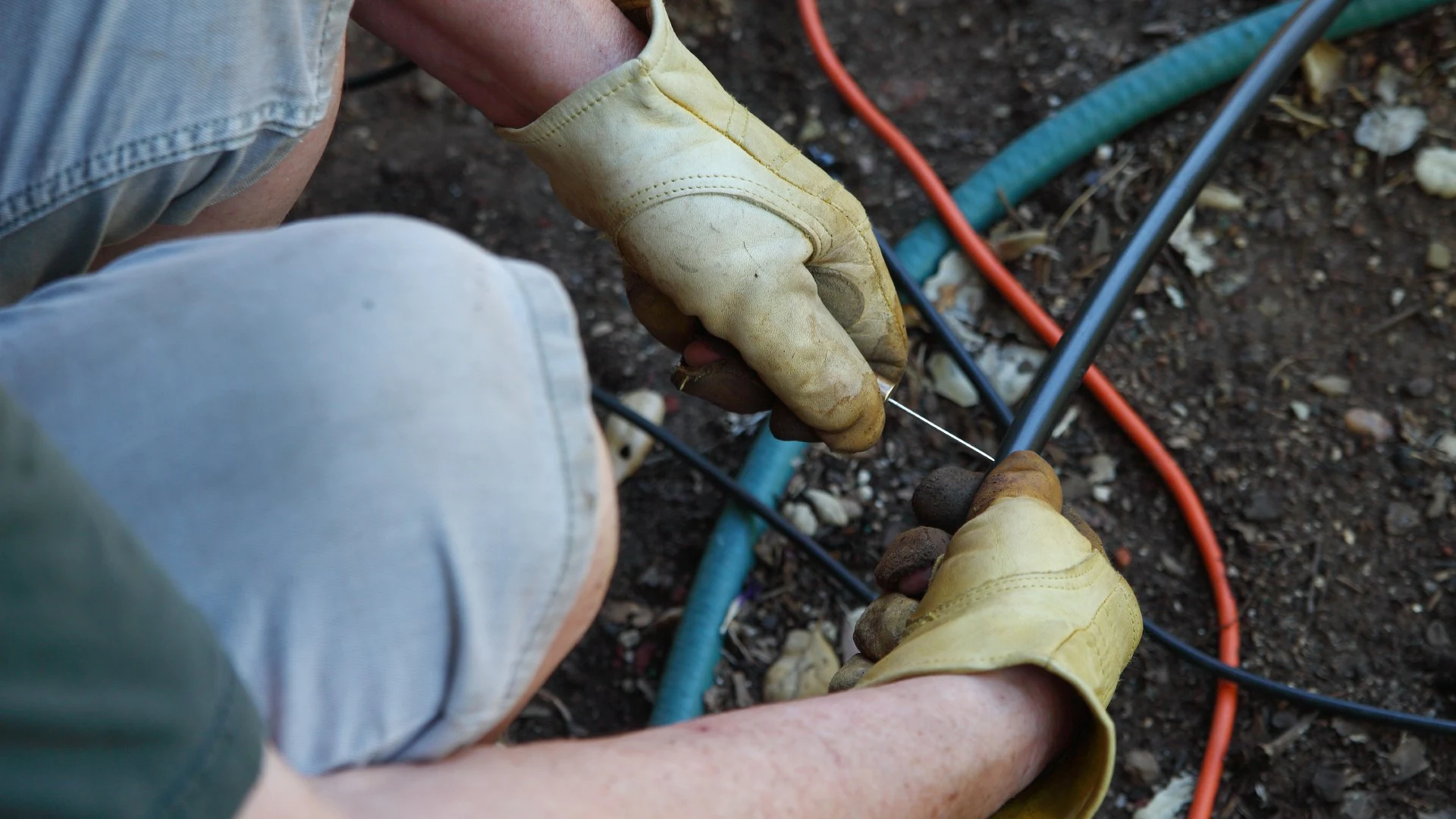 Professional repairing irrigation system in ground in New Braunfels, TX.