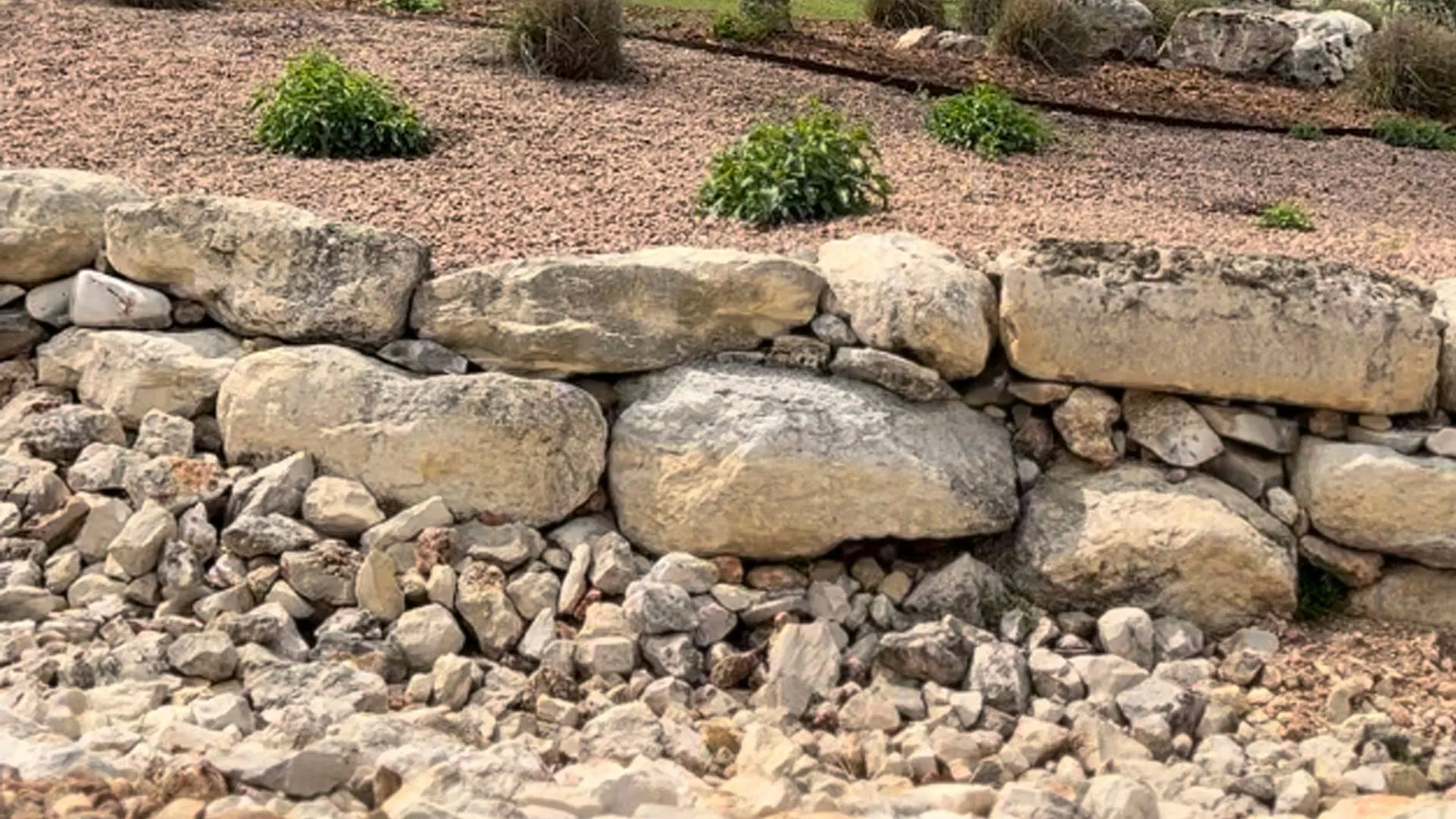 Variety of rocks chosen for ground covering in New Braunfels, TX.