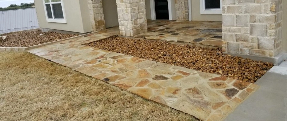 Beige stone walkway installed for a customer in New Braunfels, TX.