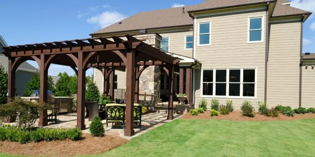 Brown pergola installed at a home in Buda, TX.