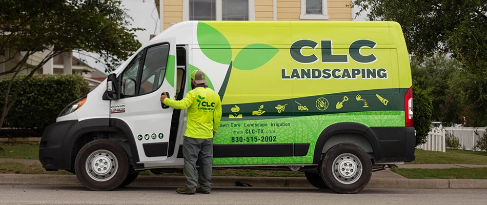 Our employee opening the driver's side door on a company van in San Marcos, TX. 