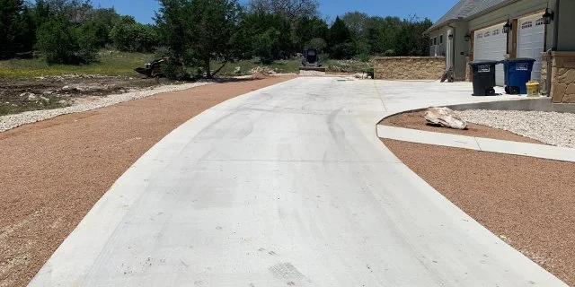 Concrete driveway installed at a home in Buda, TX.