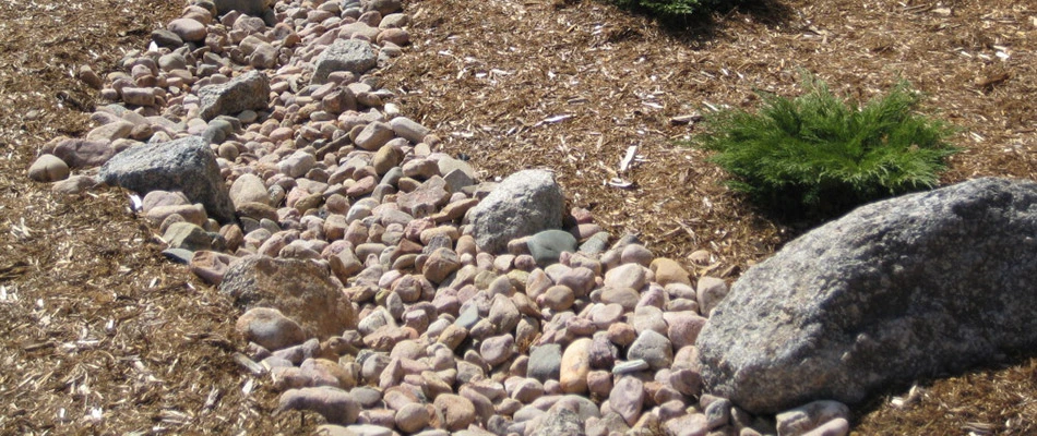 A French drainage system built with rocks by a home in New Braunfels, TX.