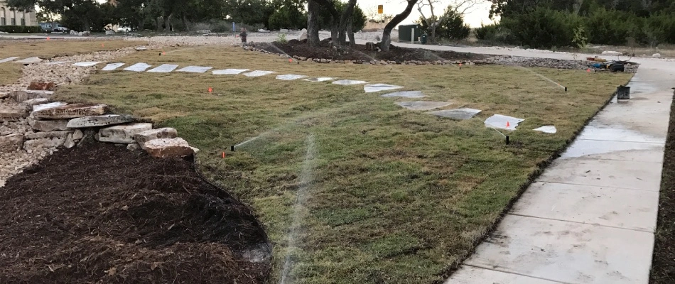 Irrigation sprinklers installed over sod lawn in New Braunfels, TX.