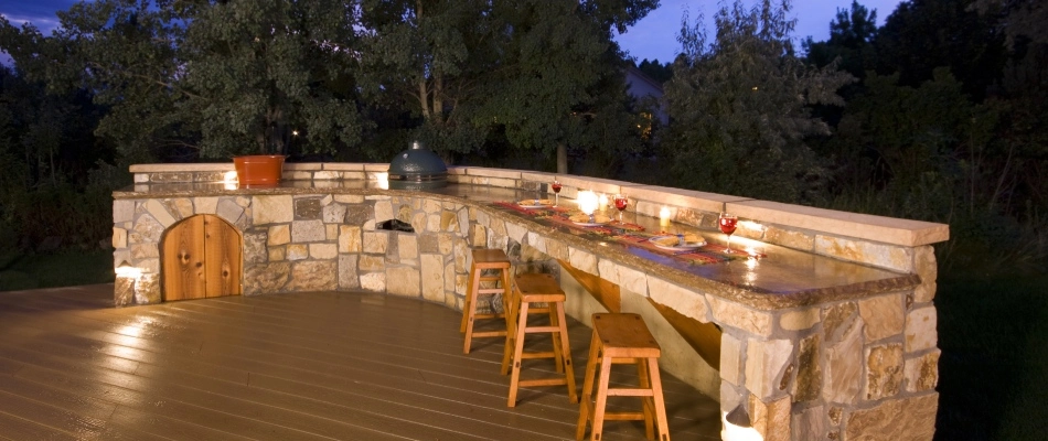 Lighting installed for outdoor kitchen and bar seating area in Buda, TX.