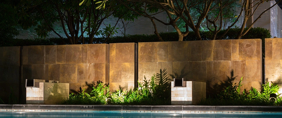 Beautiful pool and landscape with led lights illuminating the area near Buda, TX.