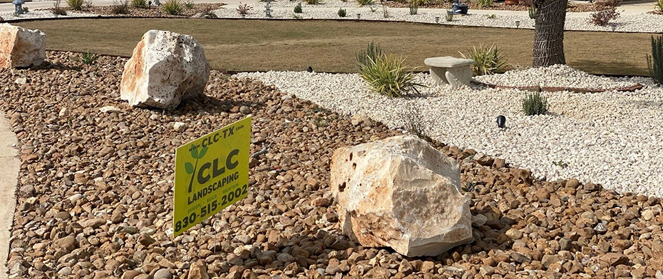 A yard full of very neat rock landscape beds after a spring cleanup in San Marcos, TX.
