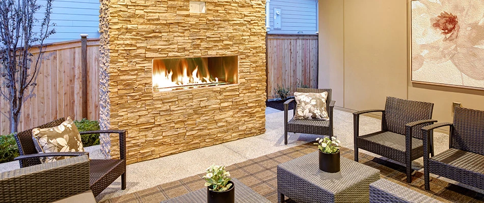 A beautiful gas fireplace with seating at a home in and around Buda, TX.