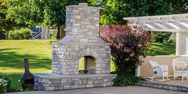 Custom outdoor fireplace built on a patio near San Marcos, TX.