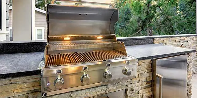 Outdoor kitchen with a grill installed near New Braunfels, TX.