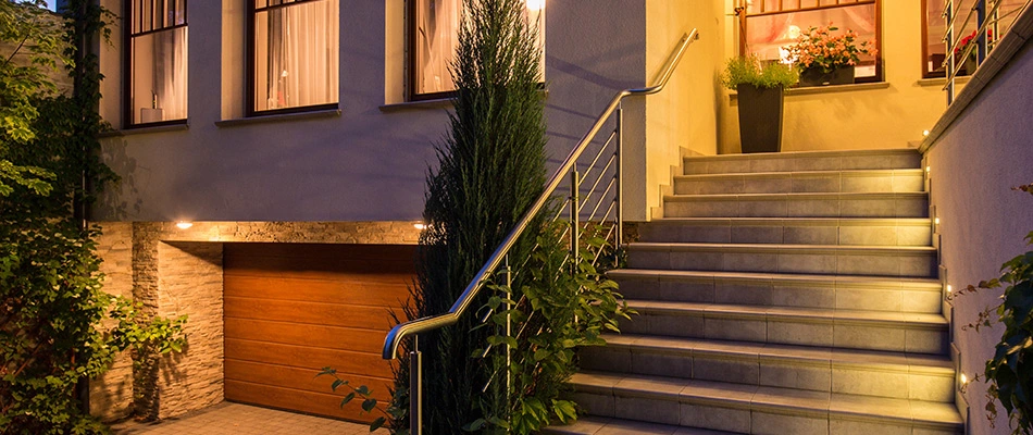Beautiful modern outdoor steps with lights along the sides at night time near Buda, TX.