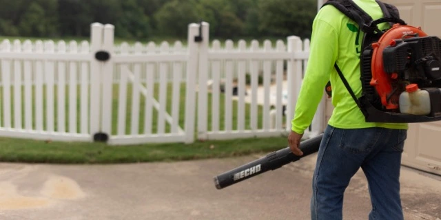 Leaf blower removing debris during a spring cleanup near Seguin, TX.