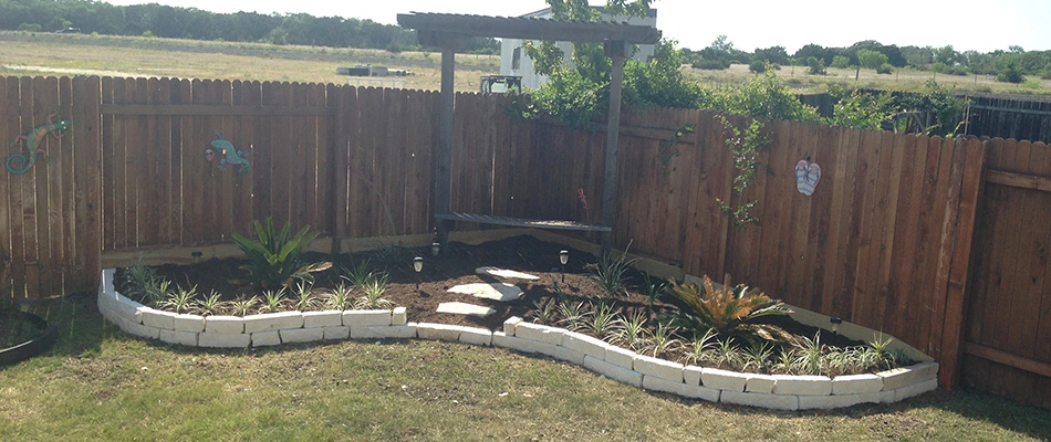 New retaining wall built for landscape bed in New Braunfels, TX.
