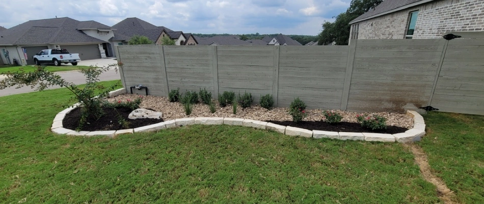 Retaining wall installed for side yard landscape bed in Canyon Lake, TX.