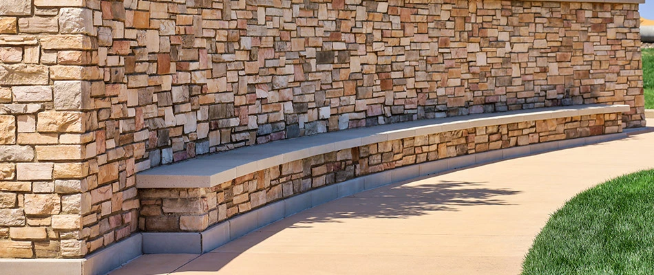 Custom stone seating wall built in Buda, TX.