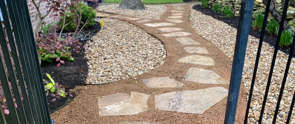 Stone and gravel walkway installed for side of home in Hays County, TX.
