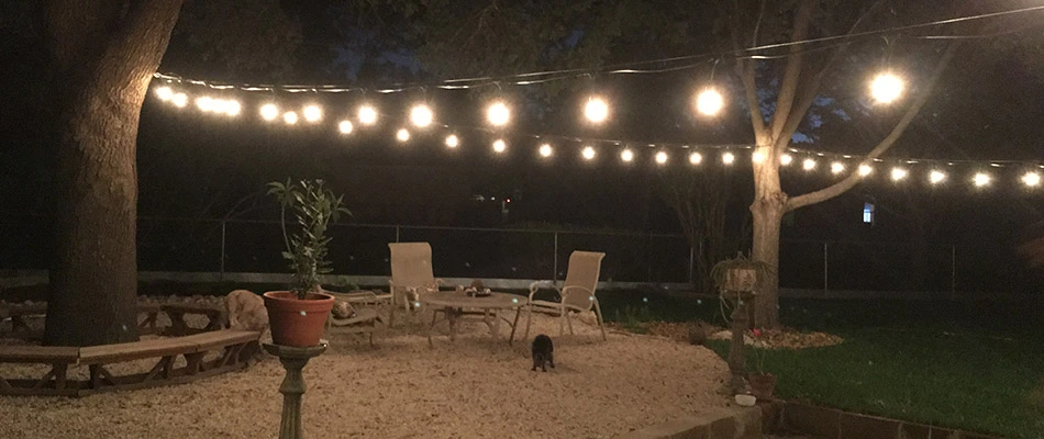 String lights hung above a backyard in Kyle, TX.