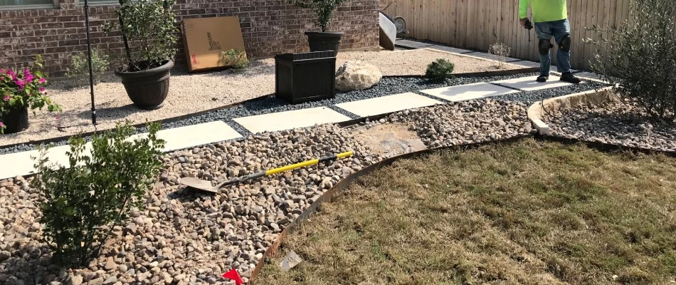 Professional inspecting walkway in Buda, TX.