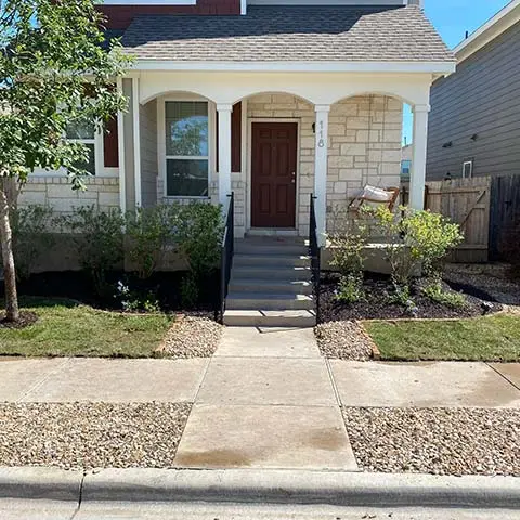 House with landscape bed and sod installation near San Marcos, TX.
