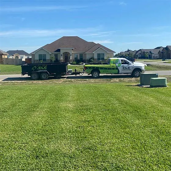CLC Landscaping lawn care work truck at a home in San Marcos, TX.